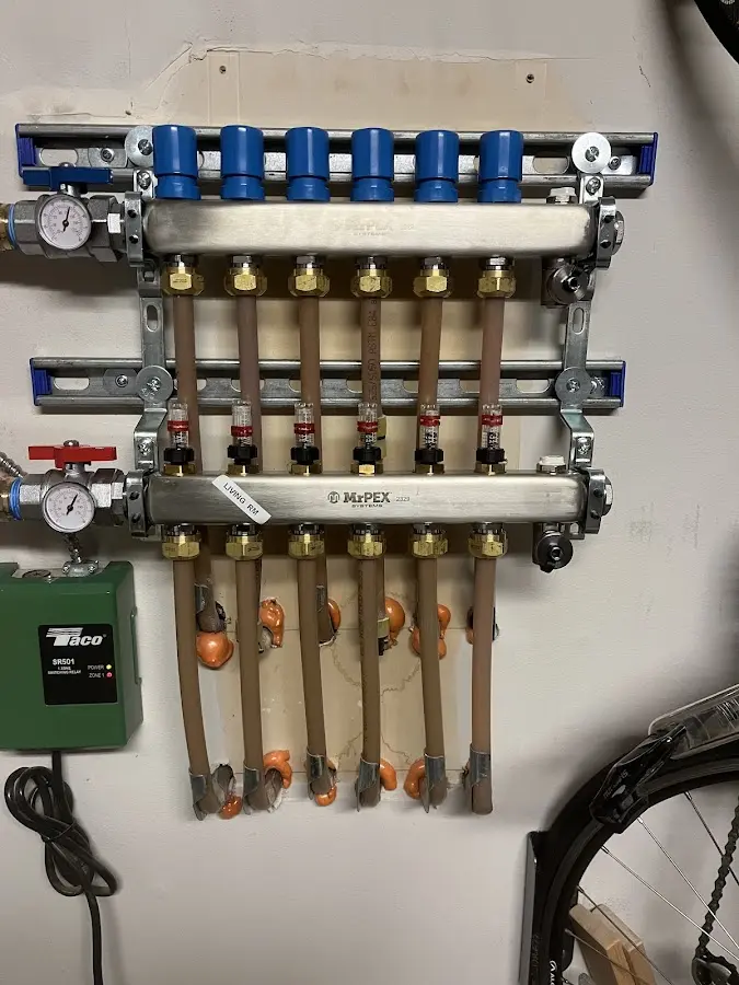 Plumber performing Water Heater Repair at a residential property in Garden City